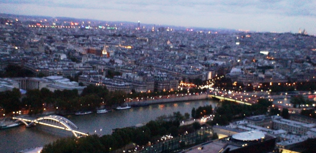 Aerial view of Paris rooftops at sunset