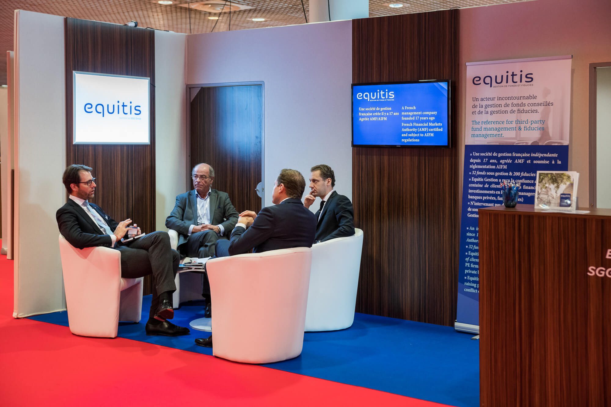 Investors networking at a private capital event